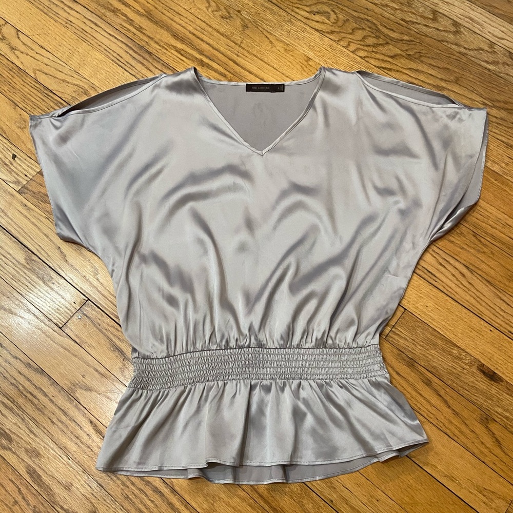 Shiny top w/ peekaboo shoulders & peplum bottom